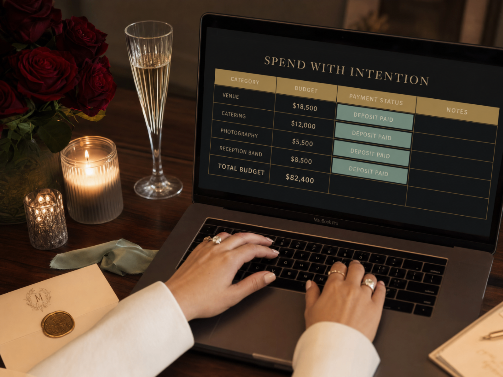 Wedding budget planning in progress on a laptop showing the Spend with Intention section.